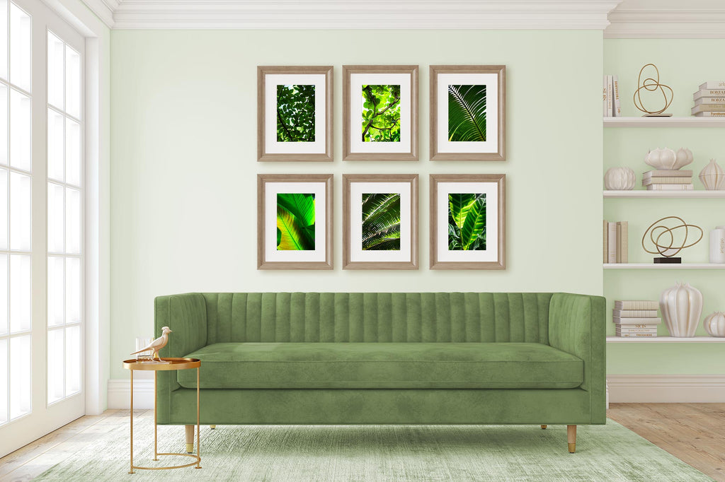 neutral with a pop of color, green and white living room, art gallery wall, art above sofa, art over couch, botanical print set, tropical print set, green print set, mid century modern living room